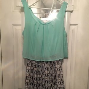 Dress with teal top and print bottom and open back